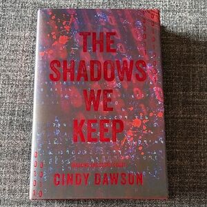 The Shadows We Keep by Cindy Dawson, sprayed edges, author signature